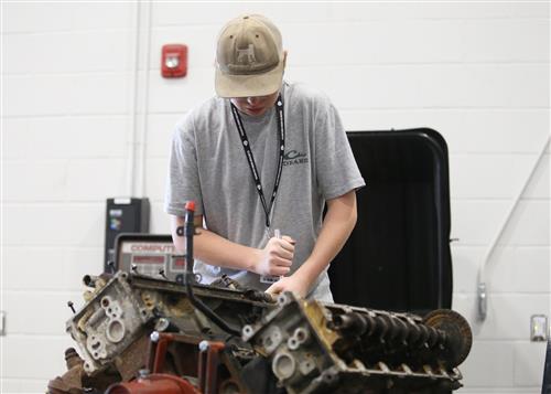 Student working on Automotive parts
